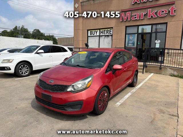 Red 2015 Kia Rio LX Sedan Front-Wheel Drive 6-Speed Automatic