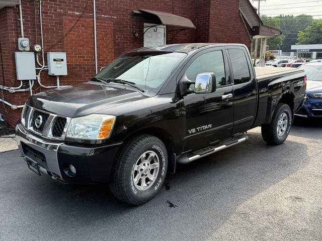 Black 2005 Nissan Titan Pickup Truck Four-Wheel Drive