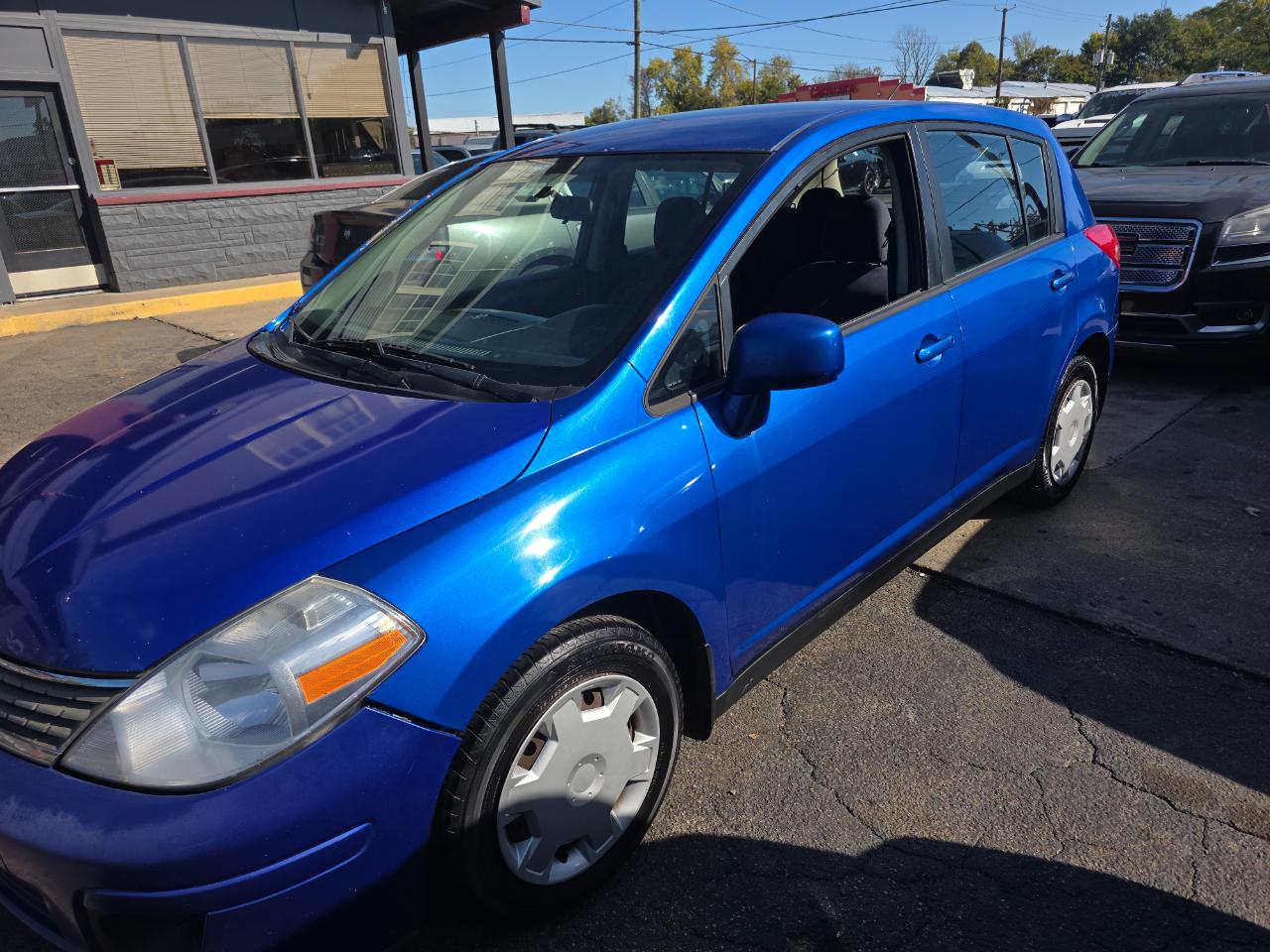Blue 2009 Nissan Versa Sedan Front-Wheel Drive Manual