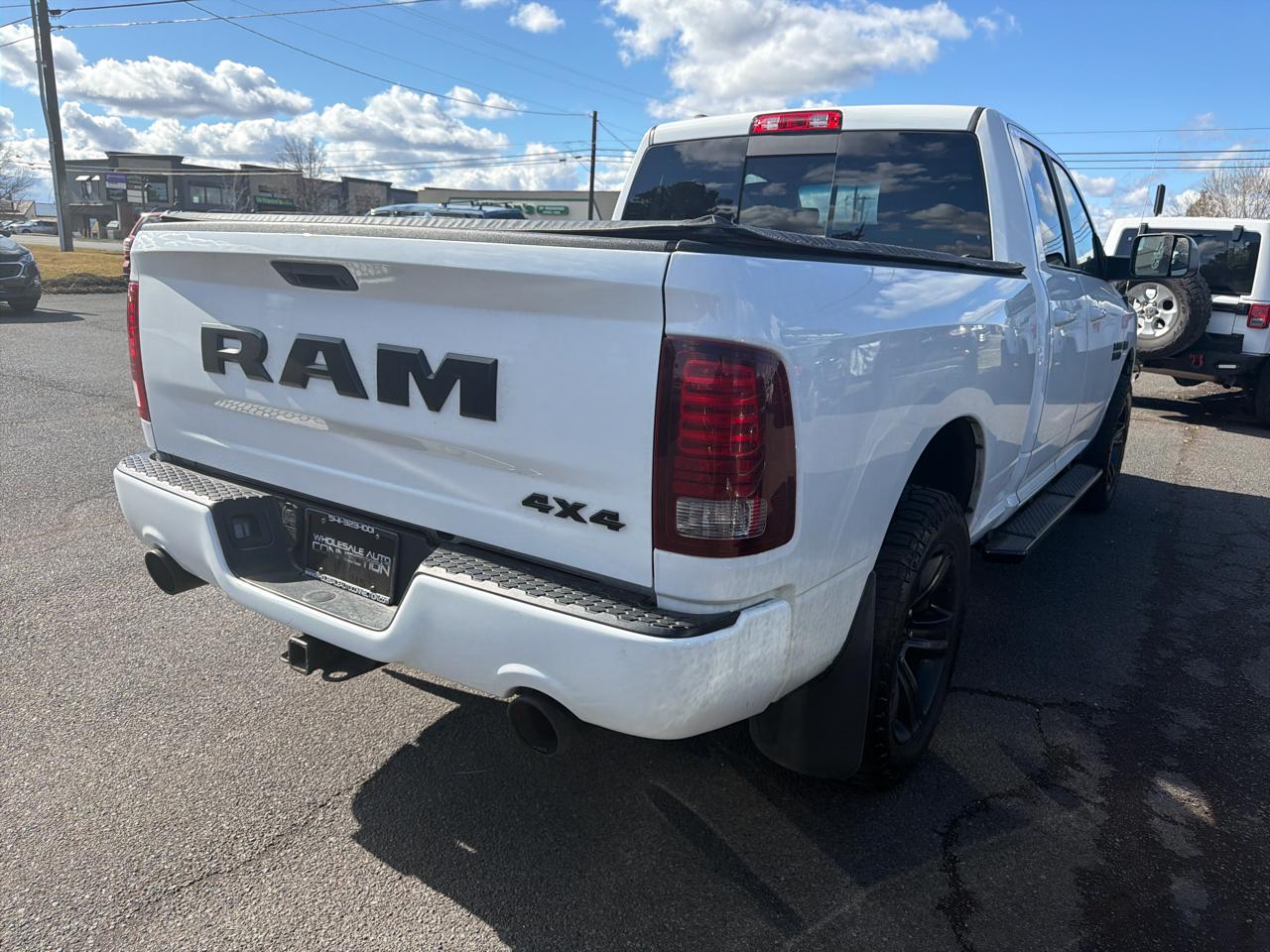 RAM 1500 4WD Quad Cab 140.5" Sport 2017