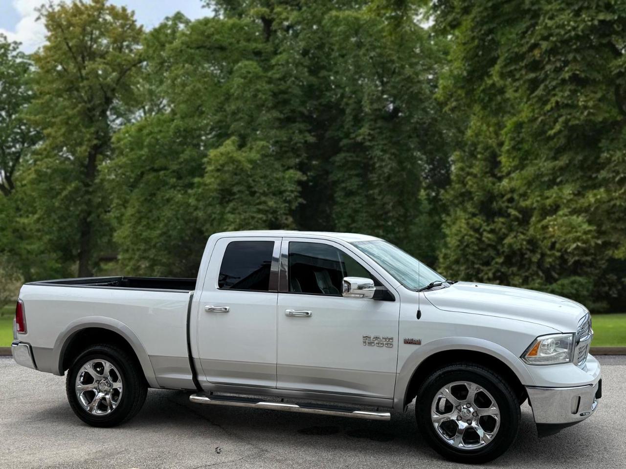 RAM 1500 4WD Quad Cab 140.5" Laramie 2016