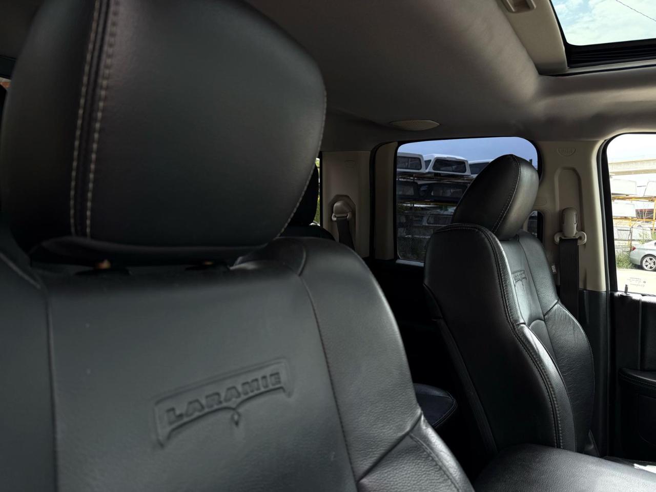 RAM 1500 4WD Quad Cab 140.5" Laramie 2016