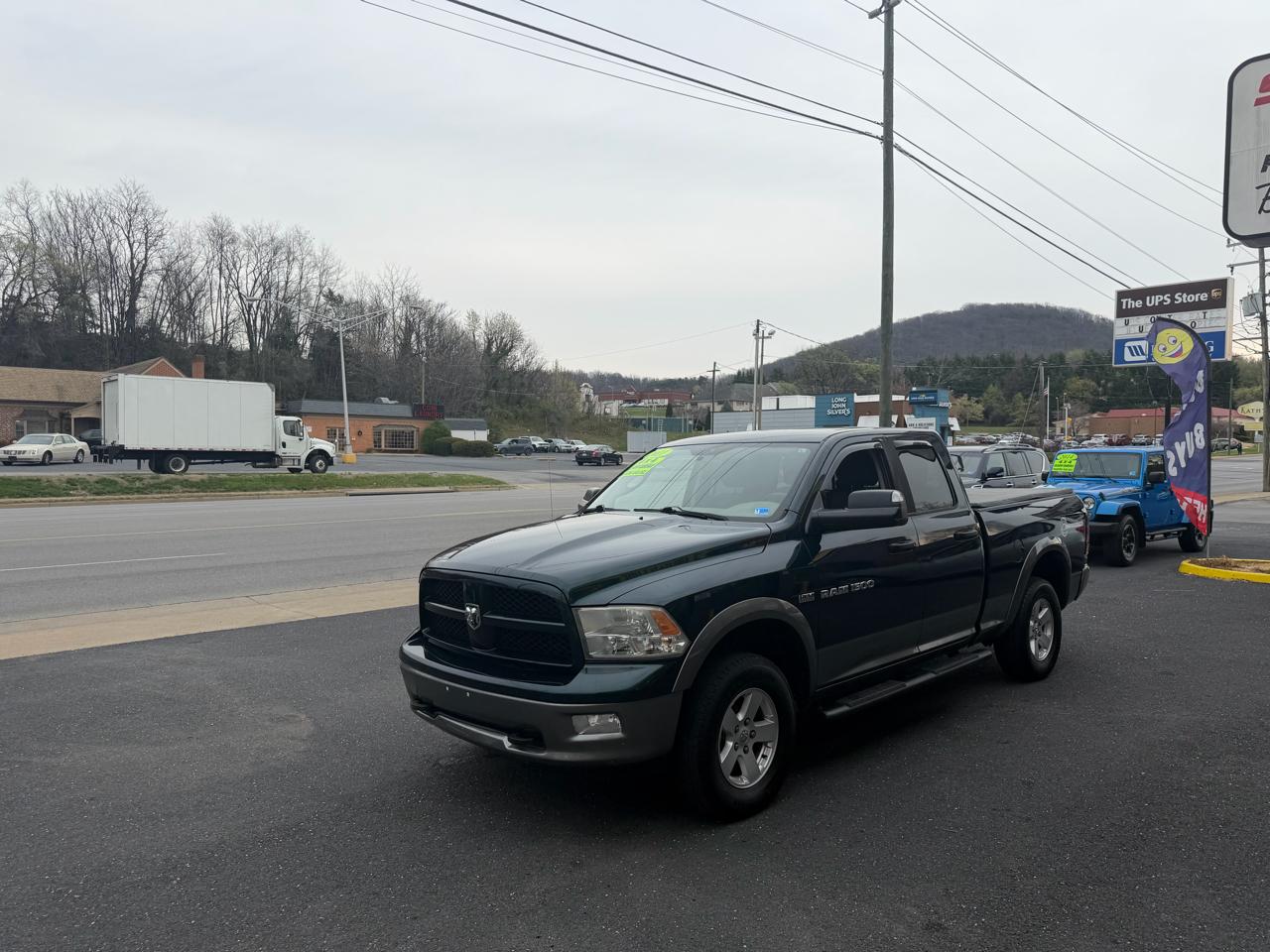2011 RAM 1500 4WD Quad Cab 140.5" Outdoorsman