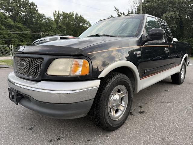Black 2000 Ford F-150 Lariat Extended Cab SB Pickup Truck Rear-Wheel Drive Automatic