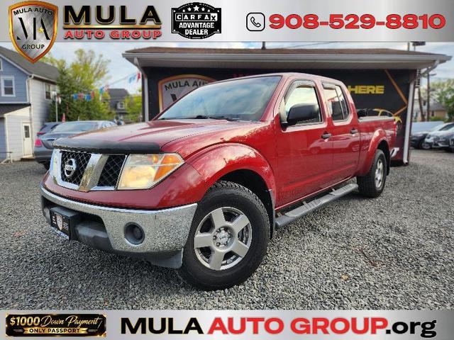 Red 2008 Nissan Frontier LE Crew Cab 4WD Pickup Truck Four-Wheel Drive
