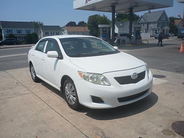 White 2009 Toyota Corolla LE Sedan Front-Wheel Drive 5-Speed Automatic