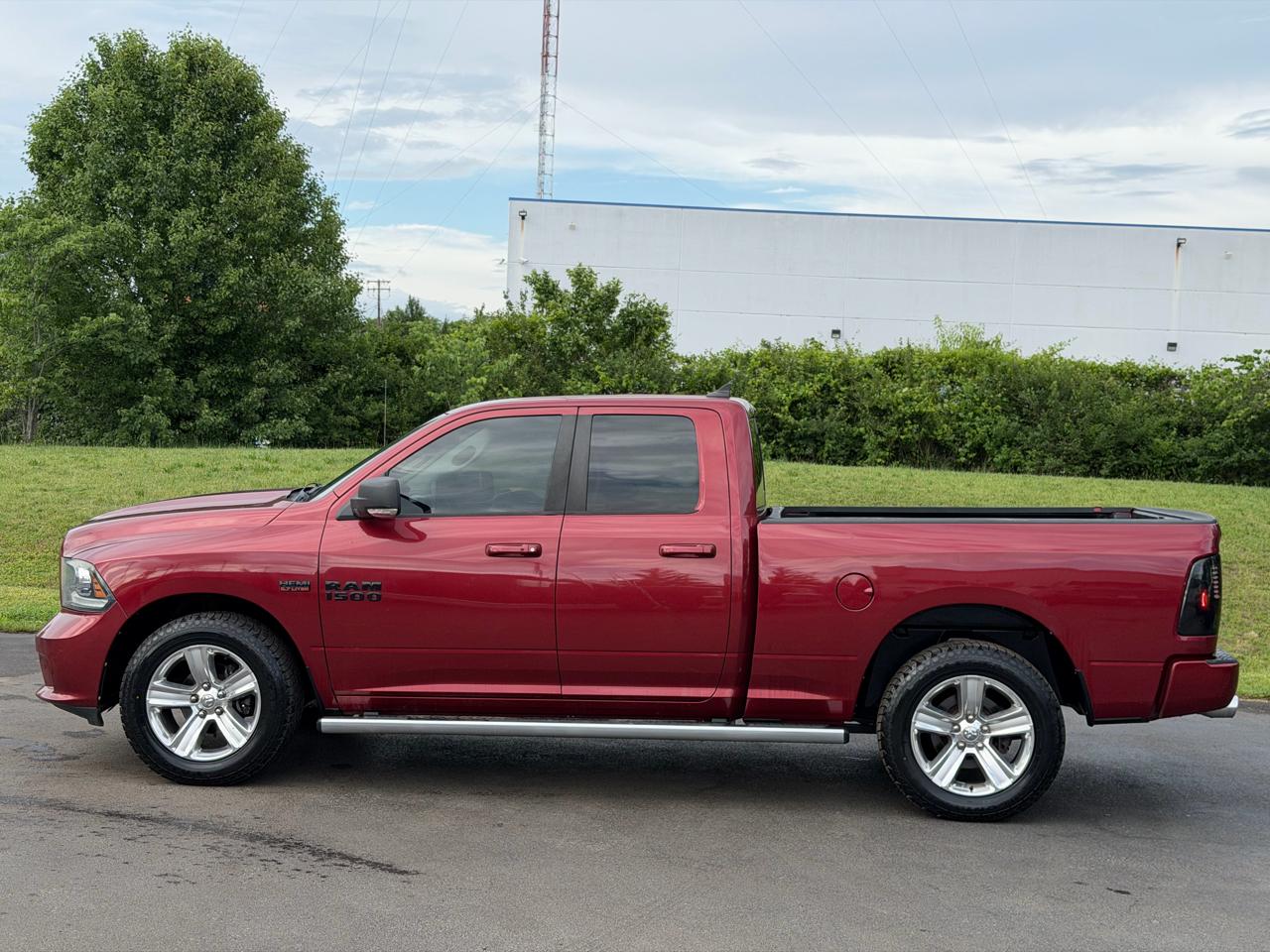RAM 1500 4WD Quad Cab 140.5" Sport 2014
