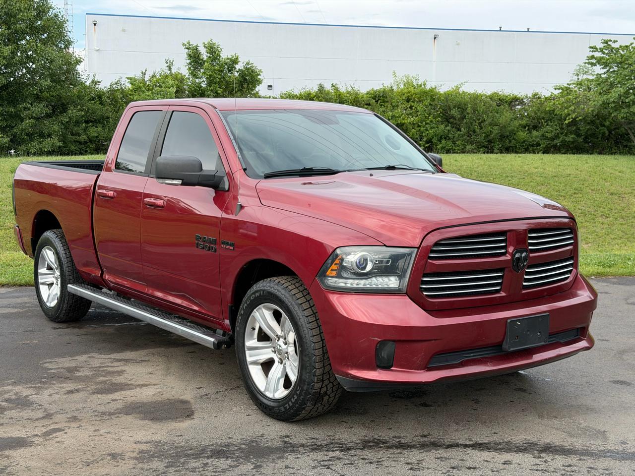 RAM 1500 4WD Quad Cab 140.5" Sport 2014