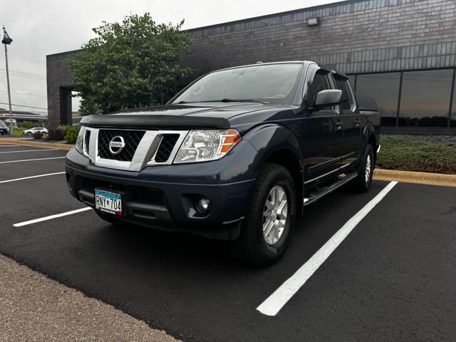 Blue 2015 Nissan Frontier Pickup Truck Four-Wheel Drive Automatic