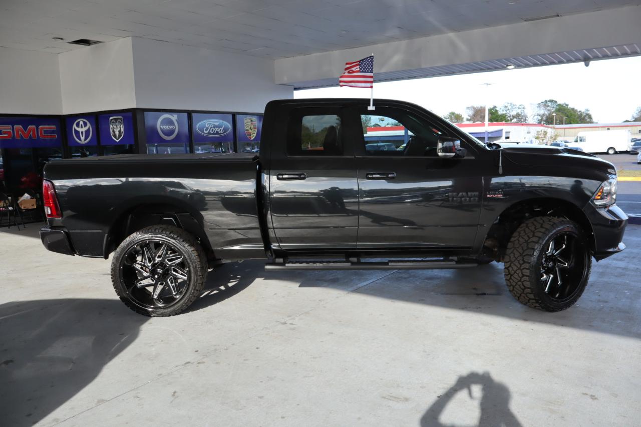RAM 1500 4WD Quad Cab 140.5" Sport 2016