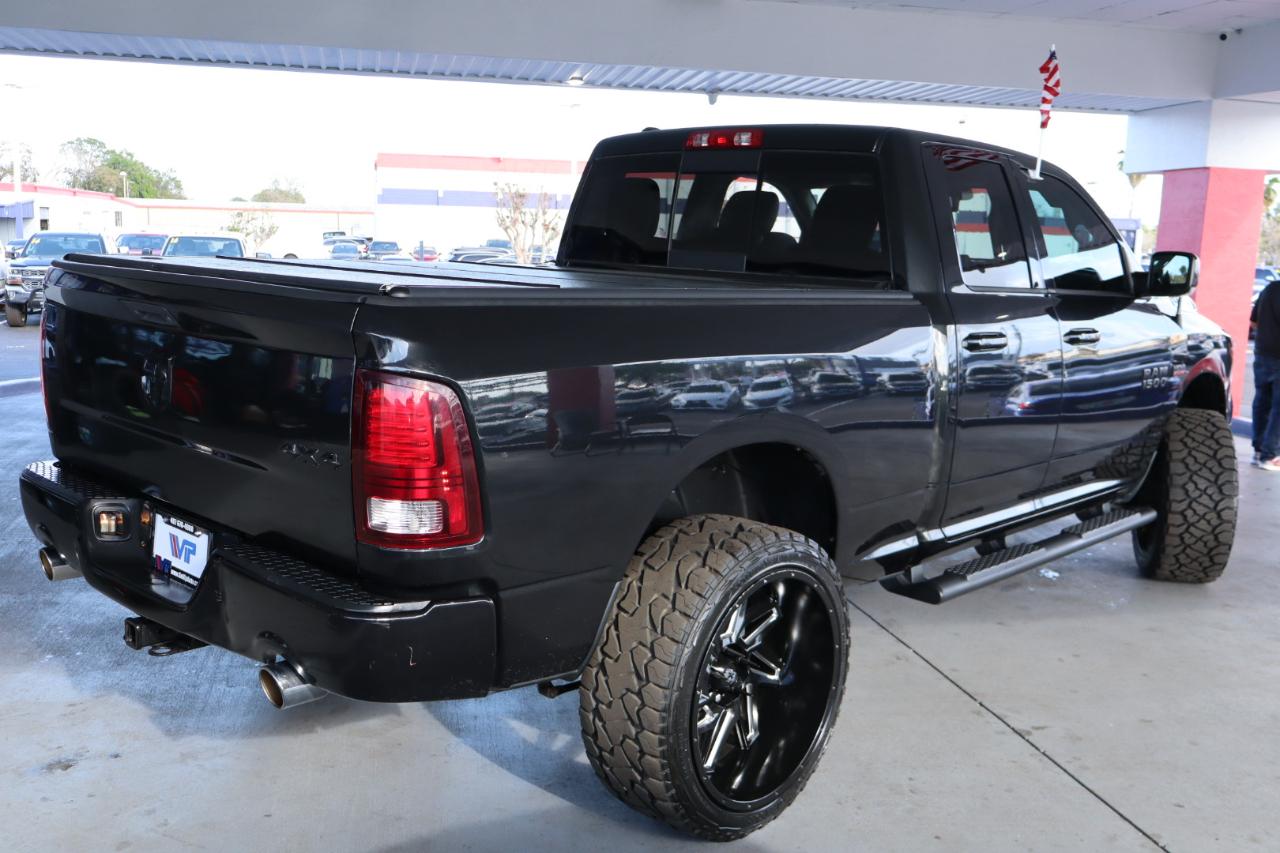 RAM 1500 4WD Quad Cab 140.5" Sport 2016