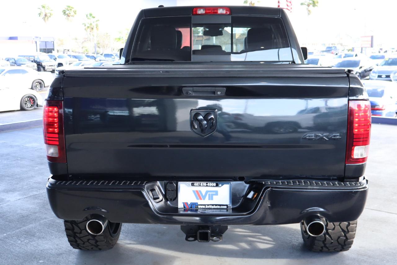 RAM 1500 4WD Quad Cab 140.5" Sport 2016