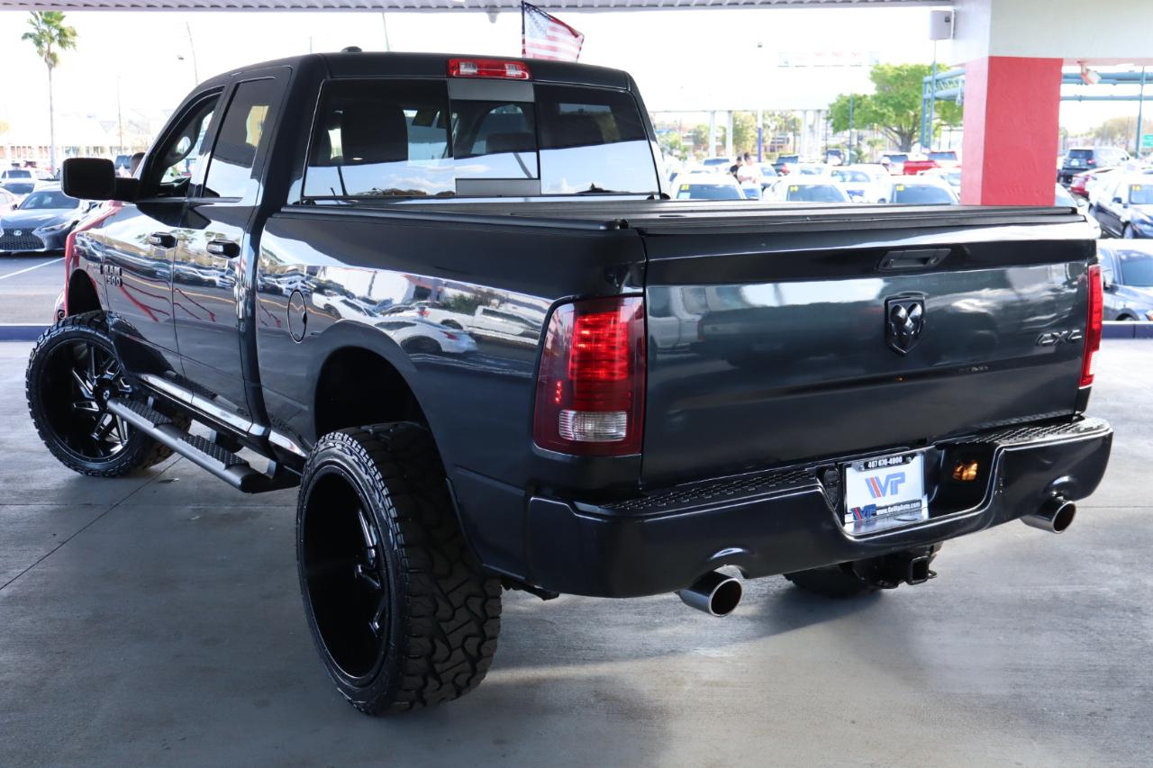 RAM 1500 4WD Quad Cab 140.5" Sport 2016