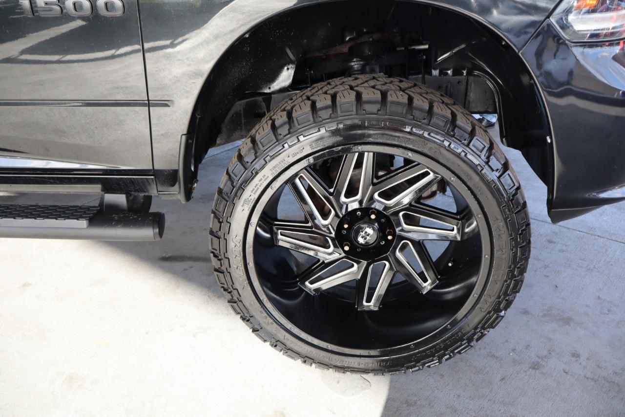 RAM 1500 4WD Quad Cab 140.5" Sport 2016