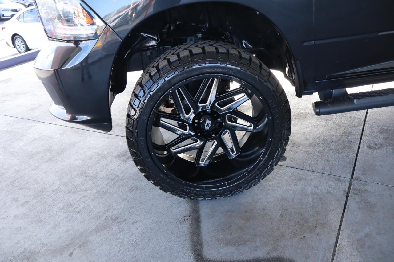 RAM 1500 4WD Quad Cab 140.5" Sport 2016