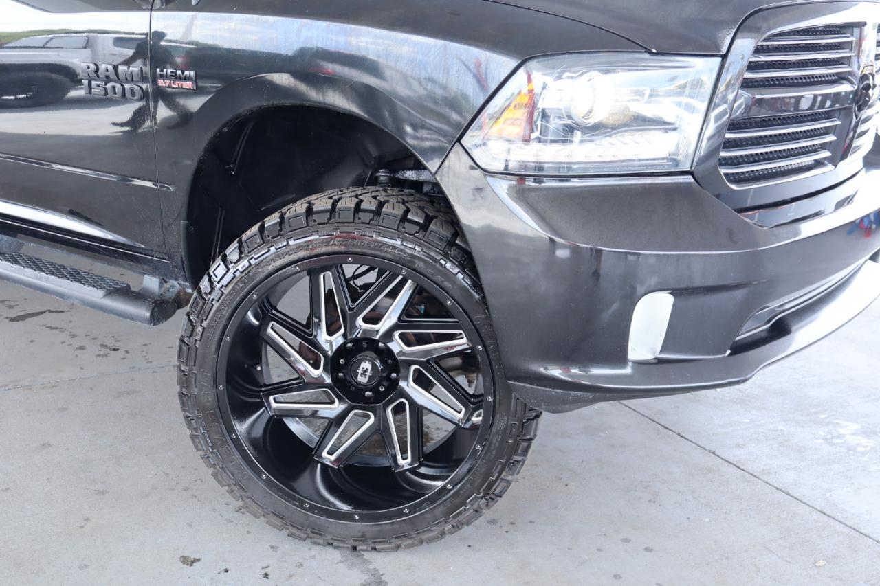 RAM 1500 4WD Quad Cab 140.5" Sport 2016