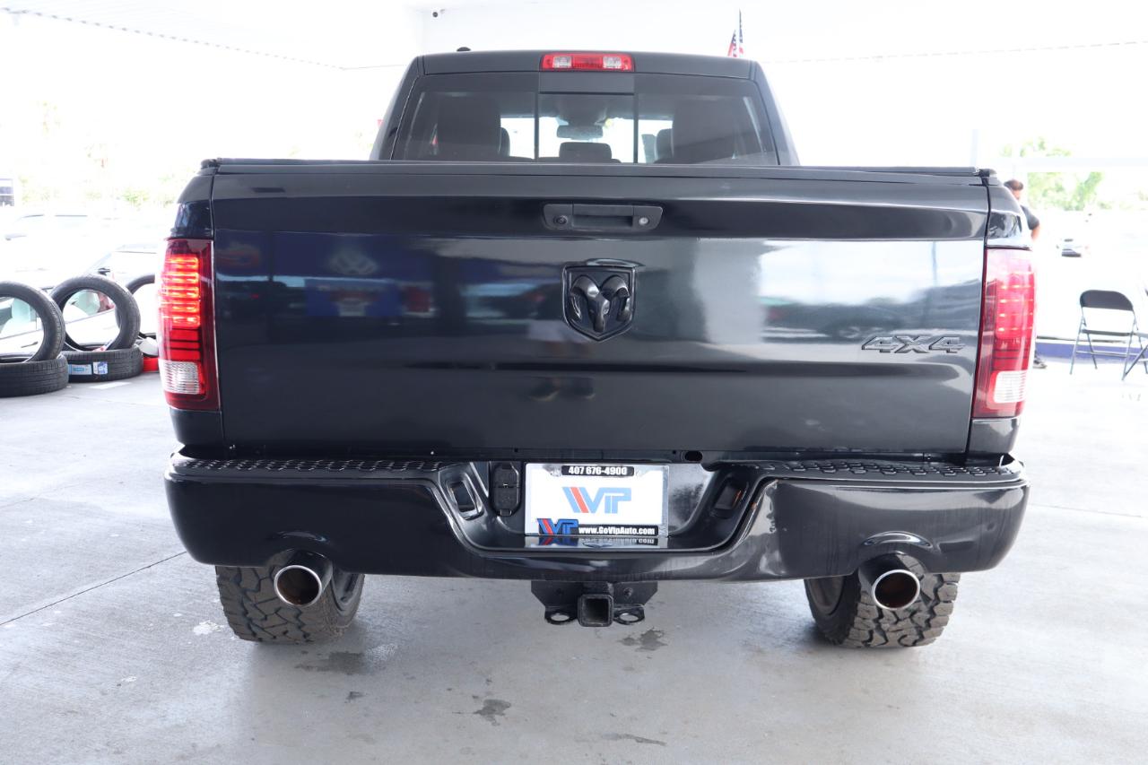 RAM 1500 4WD Quad Cab 140.5" Sport 2016