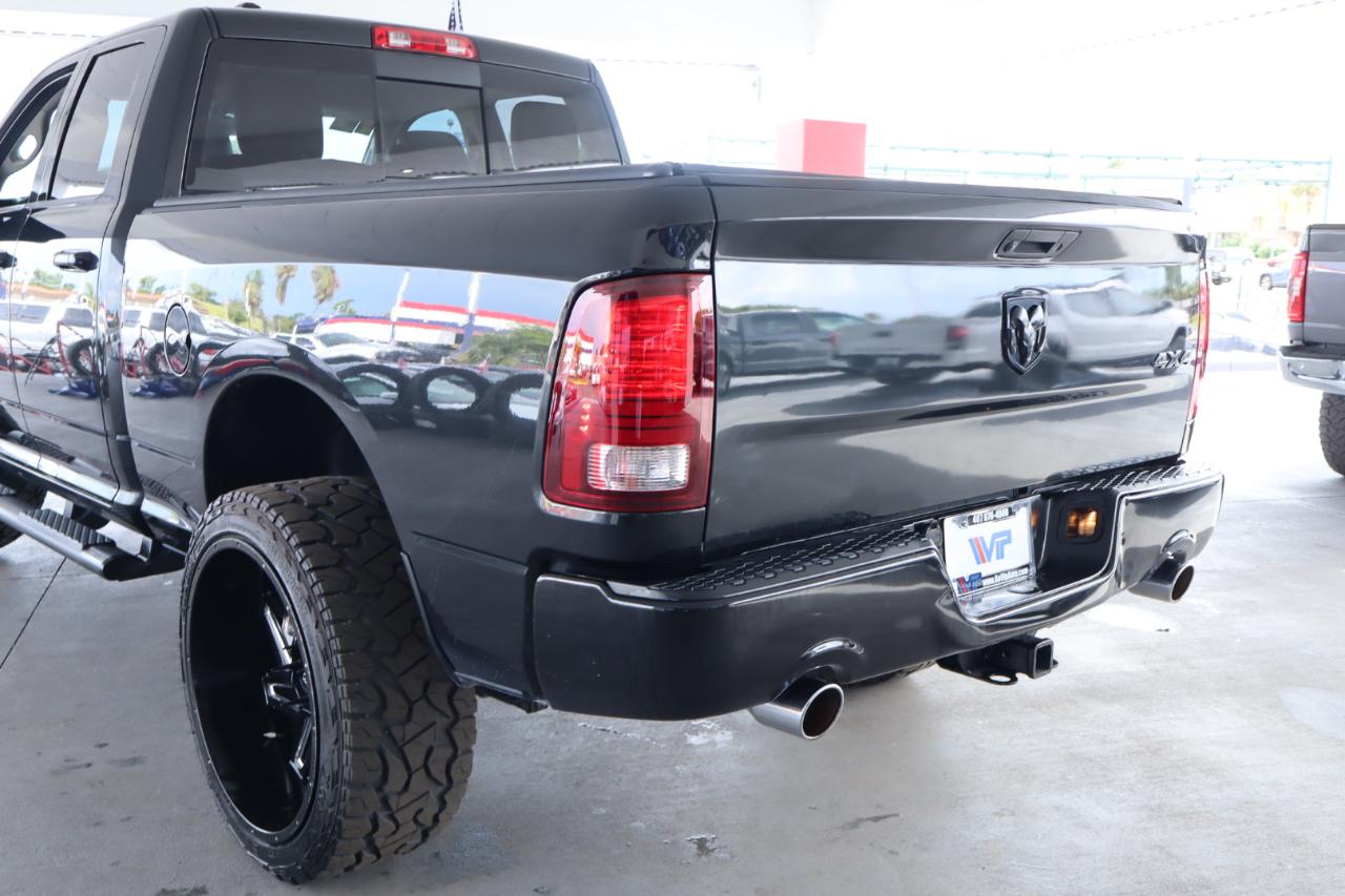 RAM 1500 4WD Quad Cab 140.5" Sport 2016