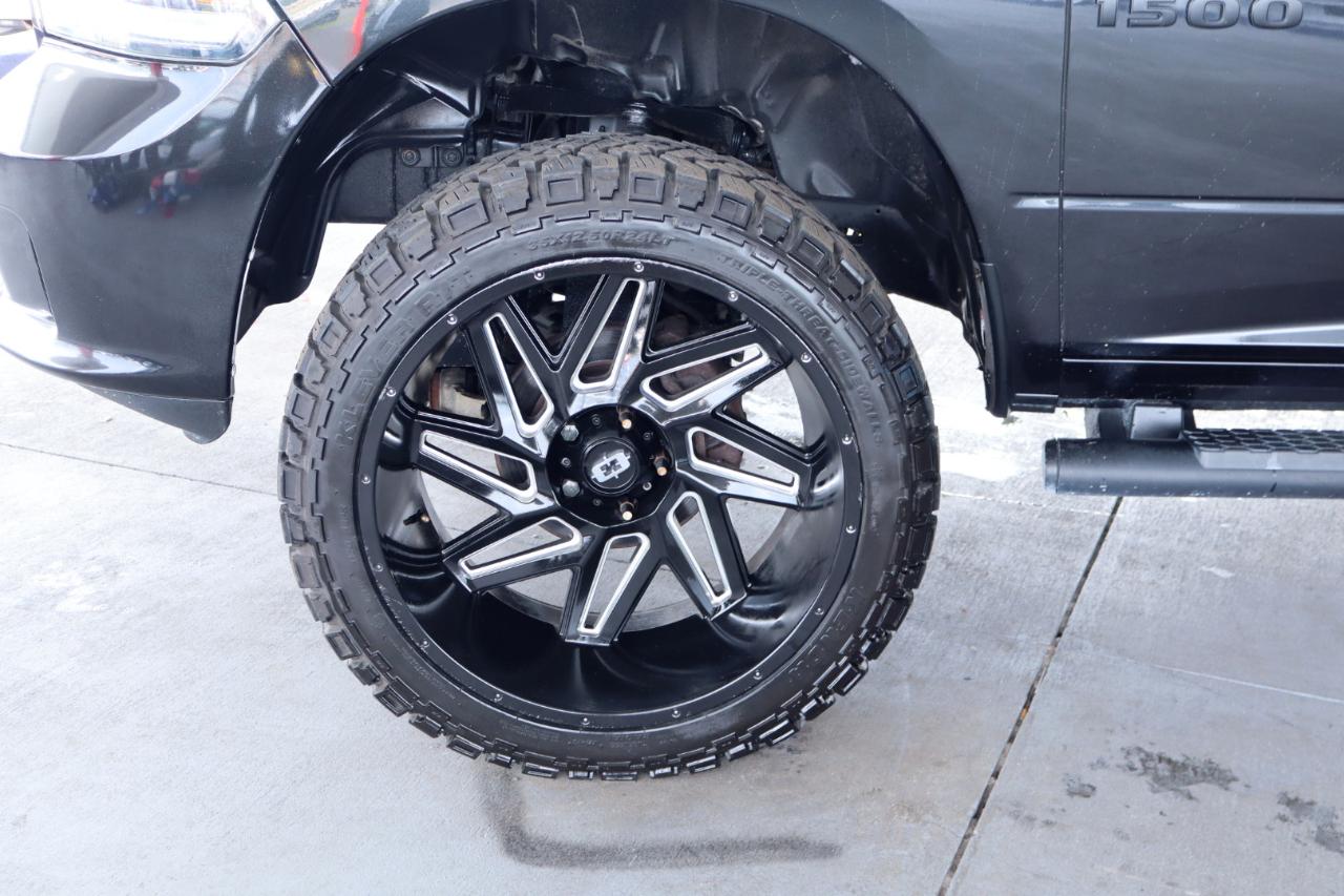 RAM 1500 4WD Quad Cab 140.5" Sport 2016