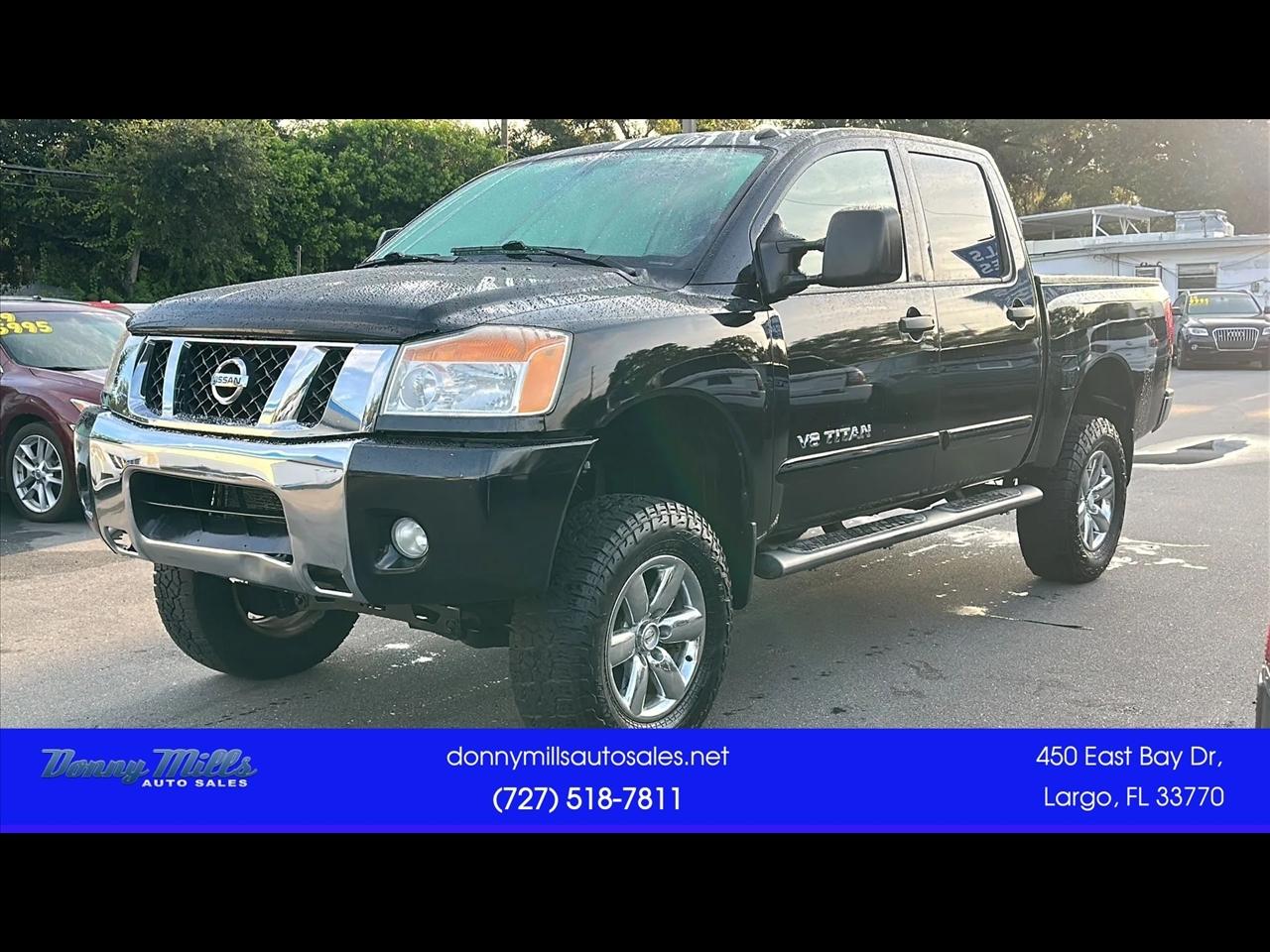 Black 2013 Nissan Titan Pickup Truck Four-Wheel Drive 5-Speed Automatic