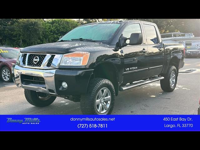 Black 2013 Nissan Titan Pickup Truck Four-Wheel Drive 5-Speed Automatic