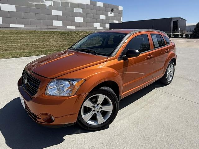 Orange 2011 Dodge Caliber Mainstreet FWD Hatchback Front-Wheel Drive Continuously Variable Transmission