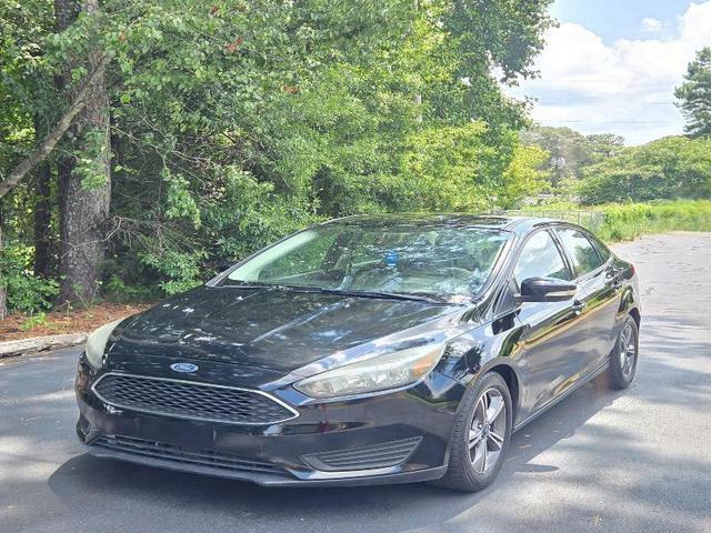 Black 2017 Ford Focus Sedan Front-Wheel Drive 4-Speed Automatic