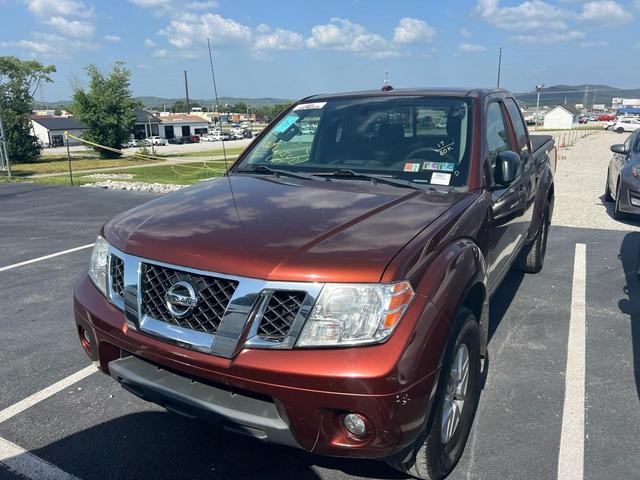 Orange 2017 Nissan Frontier Pickup Truck Four-Wheel Drive Automatic