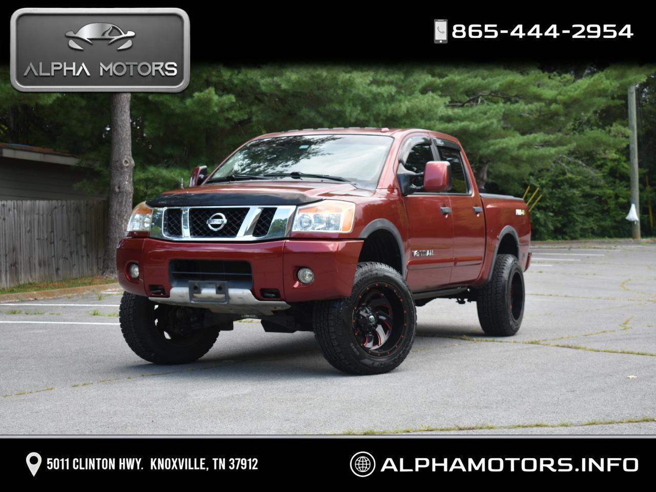 Red 2013 Nissan Titan Pickup Truck Four-Wheel Drive Automatic