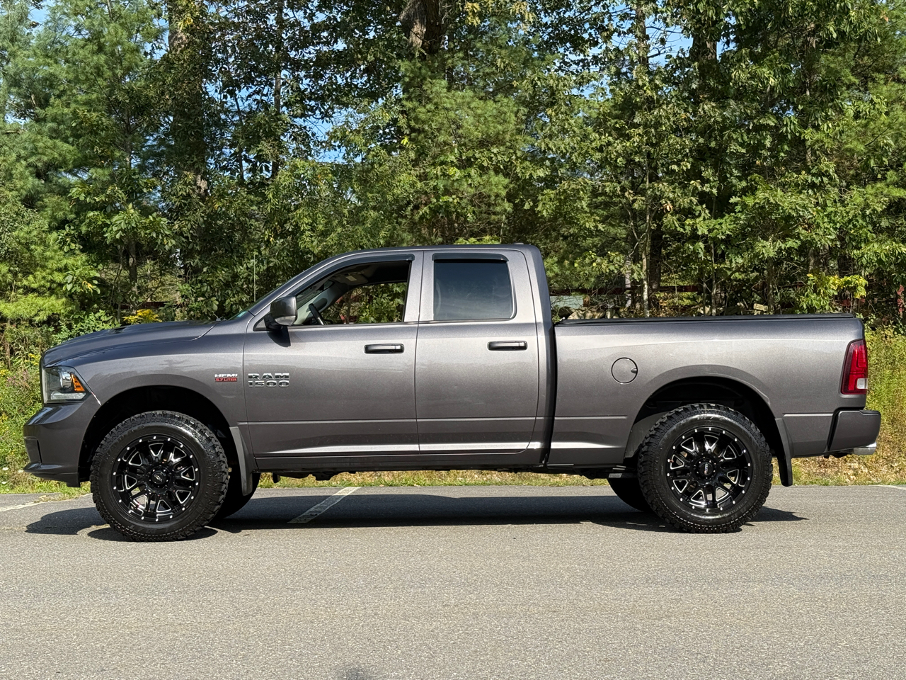 2016 RAM 1500 4WD Quad Cab 140.5" Sport