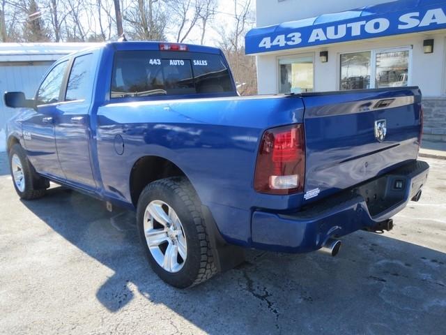 RAM 1500 4WD Quad Cab 140.5" Sport 2014