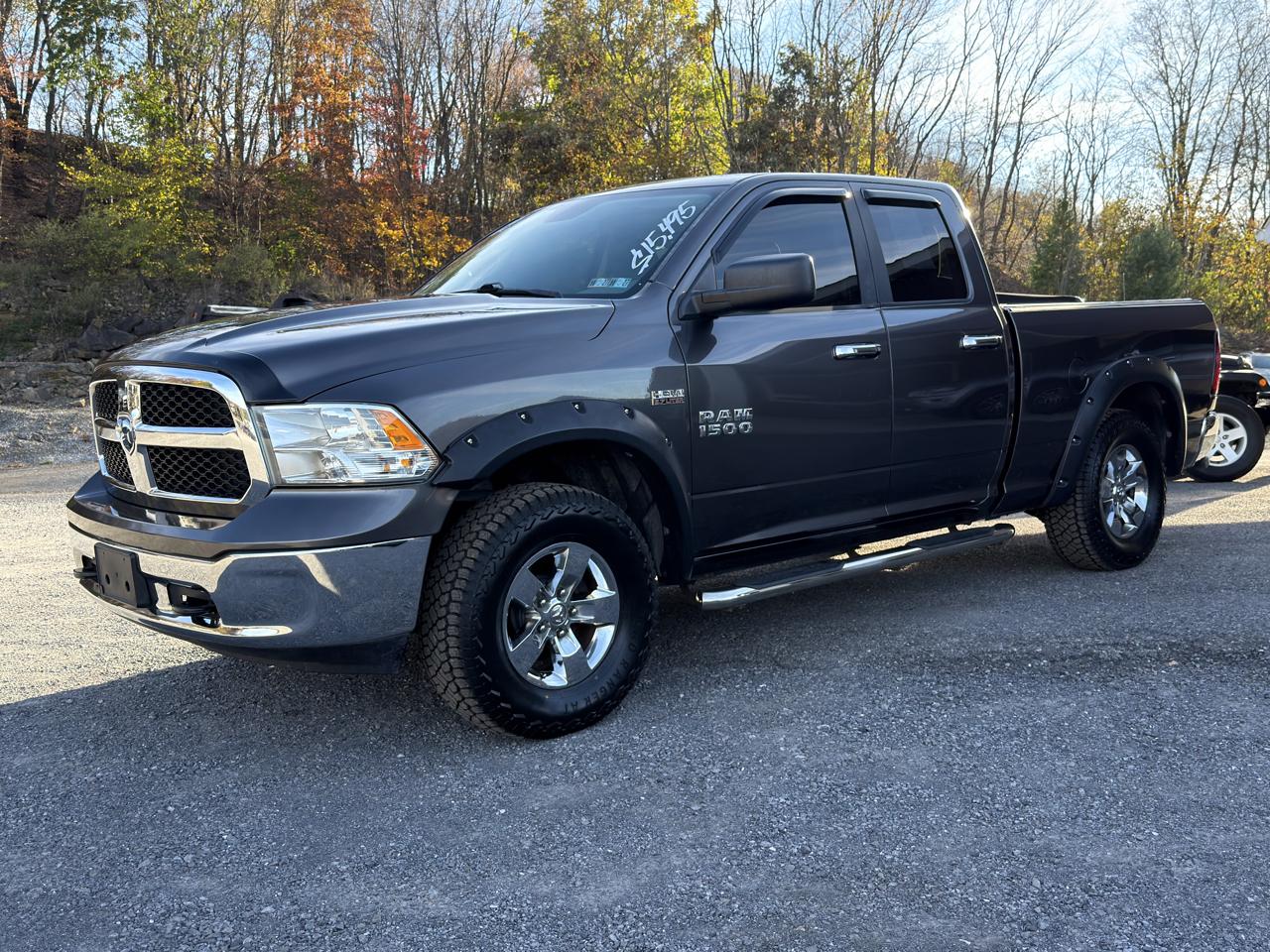 RAM 1500 4WD Quad Cab 140.5" SLT 2016