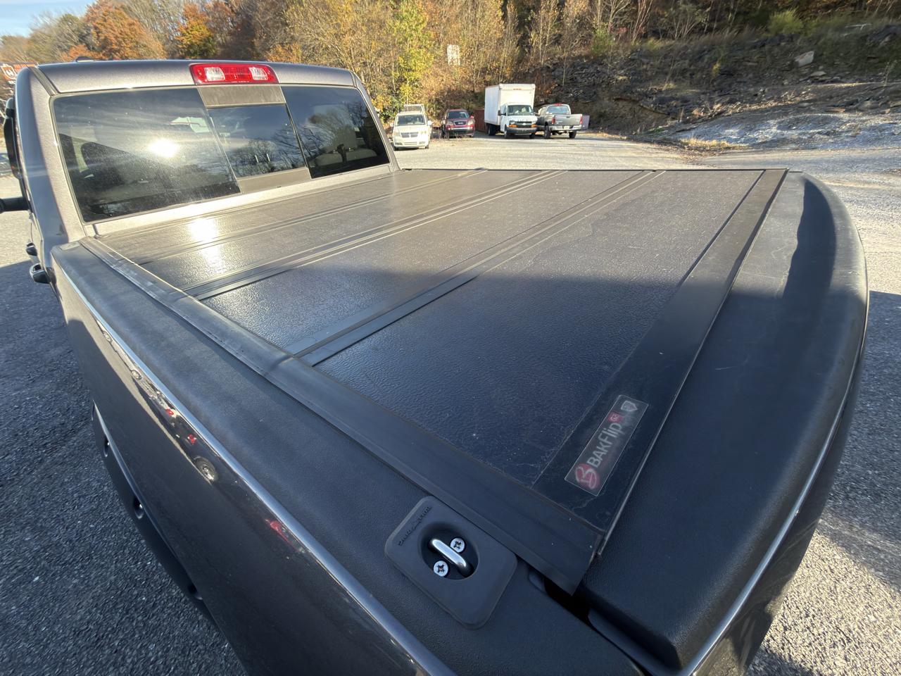 RAM 1500 4WD Quad Cab 140.5" SLT 2016