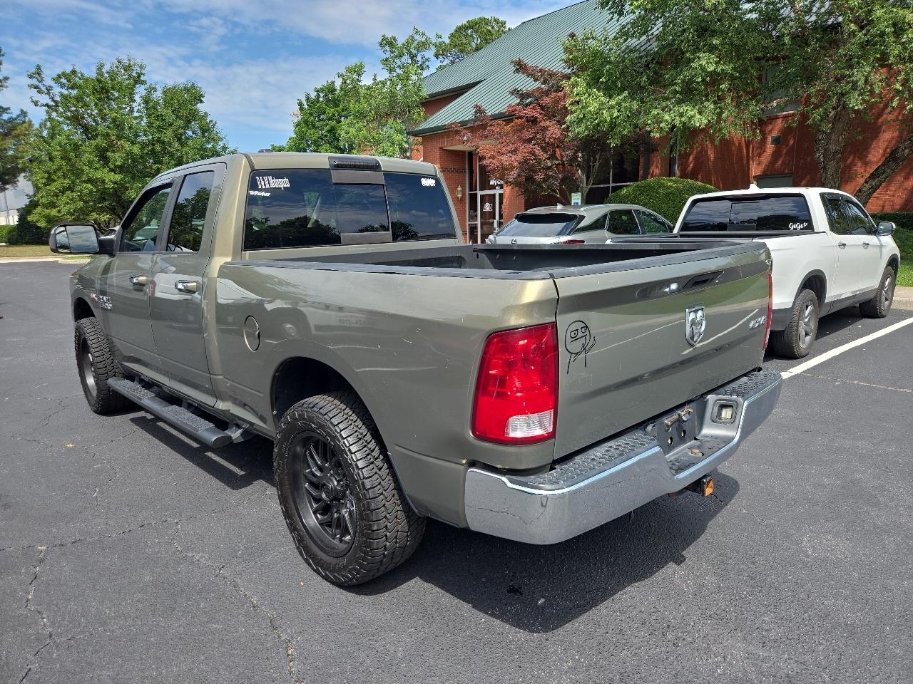 RAM 1500 4WD Quad Cab 140.5" SLT 2015