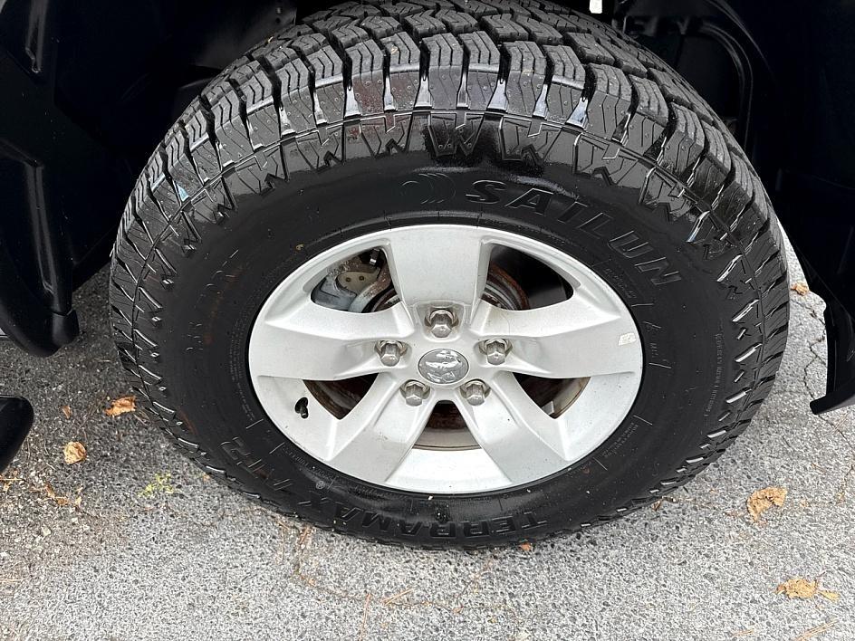 RAM 1500 4WD Quad Cab 140.5" SLT 2016