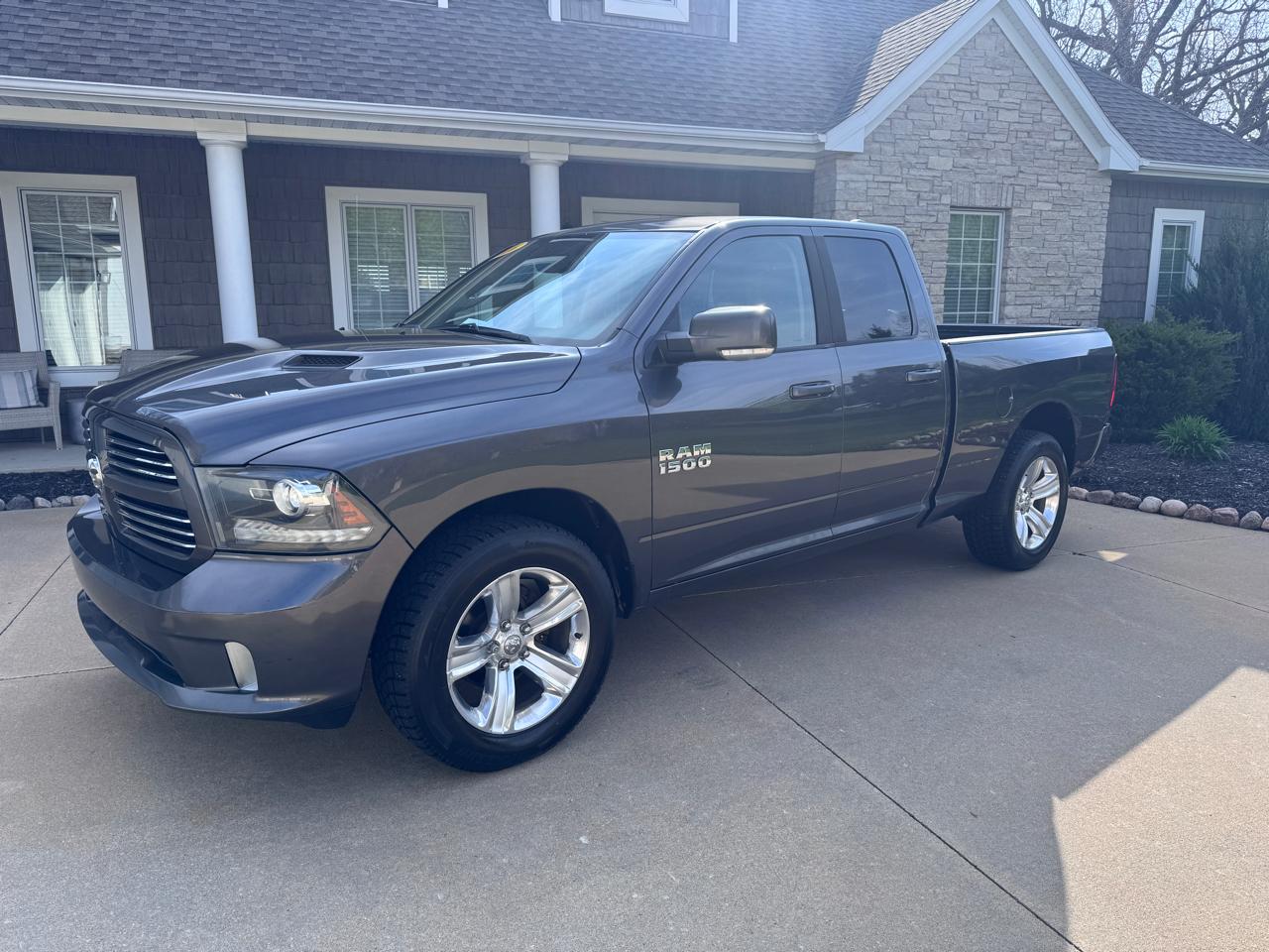 RAM 1500 4WD Quad Cab 140.5" Sport 2016