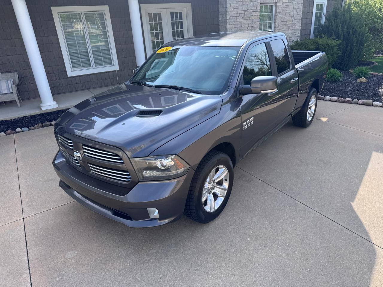 RAM 1500 4WD Quad Cab 140.5" Sport 2016