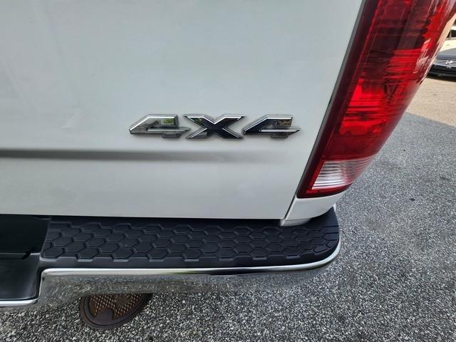 RAM 1500 4WD Quad Cab 140.5" SLT 2016