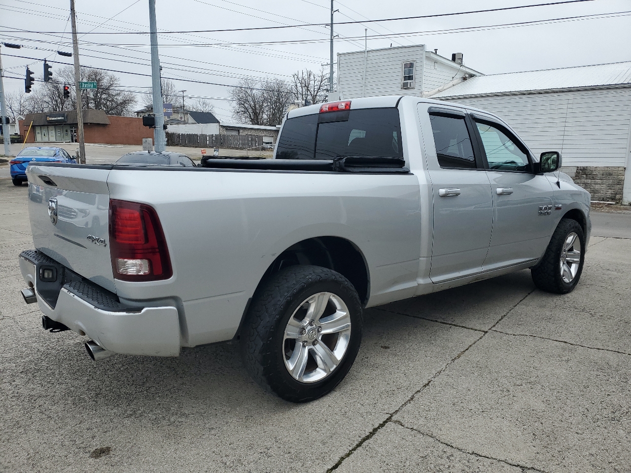RAM 1500 4WD Quad Cab 140.5" Sport 2014