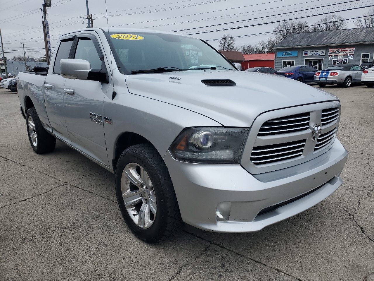 RAM 1500 4WD Quad Cab 140.5" Sport 2014
