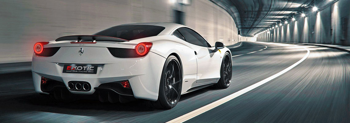 White Ferrari driving in tunnel with Exotic Car Leasing license plate